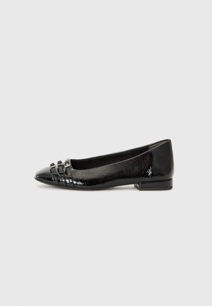 Black patent leather flat shoe with pointed toe, featuring three small decorative straps on the front, textured sides, and low heel.