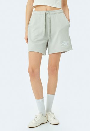 Lichtgrijze katoenen shorts met een elastische tailleband en een trekkoord, zijzakken en een bedrukt 'California Sport League' logo.