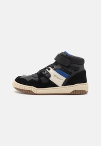 High-top sneaker featuring a black patent leather and suede upper, a blue accent, beige midsole, and a velcro strap for secure closure.