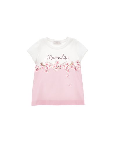 Camiseta blanca y rosa con bordado floral y el texto "Monnalisa". Mangas cortas, tejido suave, mitad inferior rosa claro, acentos decorativos.