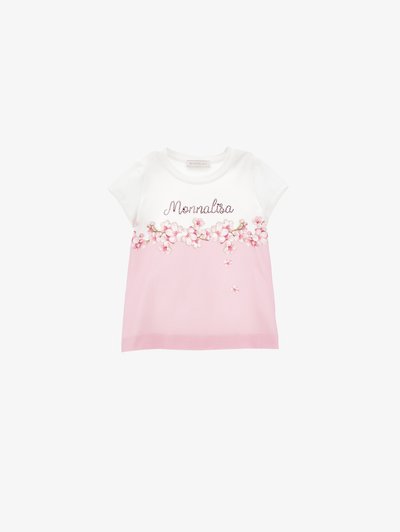 Camiseta blanca y rosa con bordado floral y el texto "Monnalisa". Mangas cortas, tejido suave, mitad inferior rosa claro, acentos decorativos.
