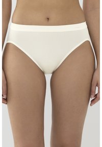 Vaaleanbeige hipster-alushousut, jotka on valmistettu sileästä ja joustavasta kankaasta, leveällä elastisella vyötärönauhalla ja vähäisellä sauman yksityiskohdalla, tarjoavat saumatonta ilmettä.