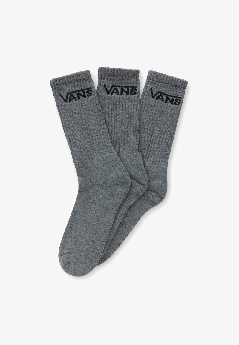 Grå ribbede strømper med en sort "VANS" logo øverst, der har en blød tekstur og traditionel strømpeform. Sælges i pakker med tre.