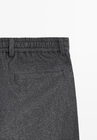 Gray, textured fabric pants featuring an elastic waistband and a single back pocket. Design includes subtle stitching details.