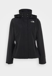 Veste noire imperméable North Face avec capuche, col montant, poches zippées et poignets ajustables.
