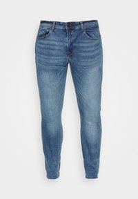 Blaue Denim-Skinny-Jeans mit Front- und Gesäßtaschen, Knopf- und Reißverschluss, dargestellt vor weißem Hintergrund.