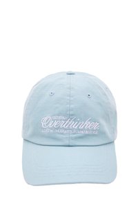Light blue cotton baseball cap with pink embroidered text saying "Cute but Overthinker. Lost in thoughts, found in style."