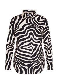 Camicia a maniche lunghe bianca e nera con motivo a strisce zebrate, dotata di colletto e chiusura frontale con bottoni. Tessuto dalla texture liscia.