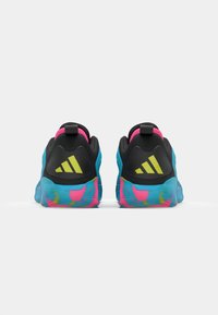 Black and blue athletic shoes with a textured upper, neon yellow accents, and a multicolored pink and blue patterned sole.