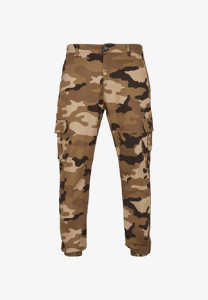Brązowe i beżowe spodnie bojówki w kamuflażu z bocznymi kieszeniami z klapami, zapinane na guziki, z szlufkami na pasek i elastycznymi ściągaczami przy kostkach.