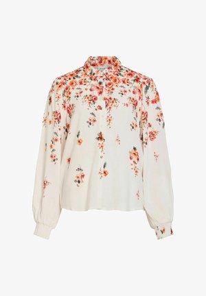 Pitkähihaisen kermaan sävyinen pusero, jossa oranssi-punainen kukkakuvio, napillinen edusta, suippo kaulus ja kerätyt kalvosimet.