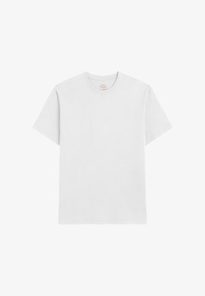 T-shirt blanc uni à manches courtes avec col ras du cou et couture visible sur le col, présenté sur un fond blanc.