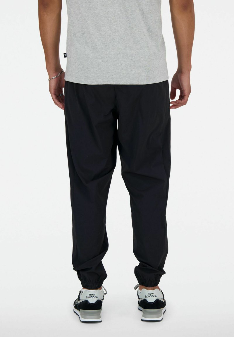 New Balance ATHLETICS JOGGER Tracksuit bottoms black Zalando