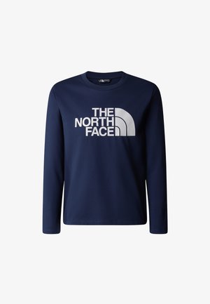 Marinblå långärmad t-shirt i bomull med en stor vit logotyp och bågformad design framtill. Enkel rund halsringning och ledig passform.