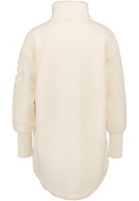 Giacca lunga in pile color crema con colletto alto e polsini in maglia allungati, vista da dietro.