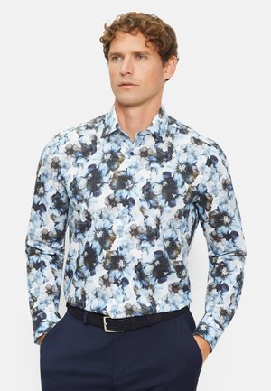 Hemd mit Knopfleiste, das ein Blumenmuster in Blau- und Schwarztönen auf weißem Hintergrund zeigt. Es besteht aus leichtem Stoff mit einer glatten Textur.