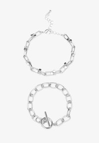 Silver metal chain bracelet set featuring two designs: one with links and rectangular accents, the other with a toggle clasp.