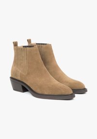 Brown suede ankle boots featuring elastic side panels, a pointed toe, and a stacked heel. Smooth texture with minimal stitching details.