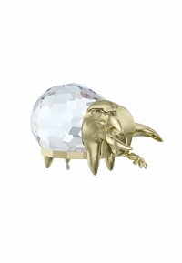 Elefantformad dekor med en genomskinlig, fasetterad kristallkropp och detaljer i guldton. Detaljerad snabel med en blomma i munnen. Stabil bas.