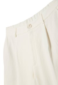 White trousers with a soft, textured fabric. Features a wide waistband, a front button closure, and two front pockets with pleats.