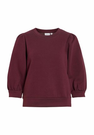 Giliai bordo spalvos crewneck stiliaus džemperis su pūslelinėmis ilgomis rankovėmis ir aptemptais rankogaliais, rodantis paprastą kasdienį stilių.