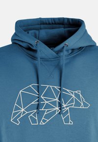 Felpa blu in cotone, con un design geometrico di un orso bianco sul davanti. Ha un cappuccio con coulisse e polsini a coste.