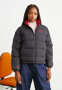 Helly Hansen - YU 23 REVERSIBLE PUFFER - Piumino - black Immagine in miniatura 1