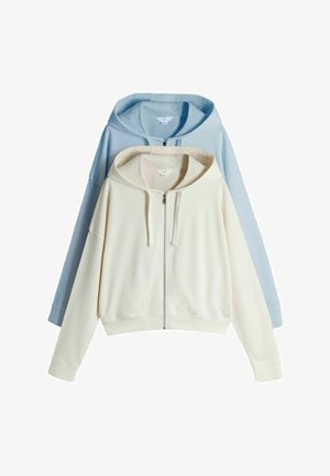 Two zip-up hoodies, one cream in front and one light blue behind, both with drawstrings and long sleeves.