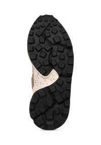 Black rubber outsole features a textured pattern with square and diamond shapes; midsole has a speckled cream color; sturdy design.