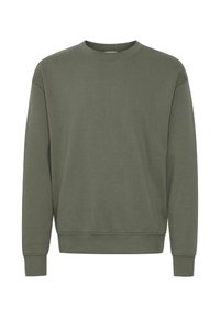 Olivzaļš džemperis no mīksta kokvilnas, ar apaļu kaklu, garām piedurknēm, ribām pie aprocēm un brīvu piegriezumu. Bez rakstiem vai akcentiem.