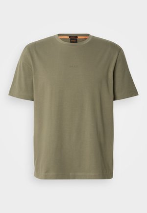 Olive green cotton crew neck t-shirt with short sleeves, featuring a subtle embossed logo on the chest and a relaxed fit.