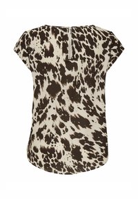 Top a maniche corte di colore crema con motivo a macchie astratte marroni. Presenta una zip sul retro e un orlo arrotondato. Realizzato in tessuto leggero.