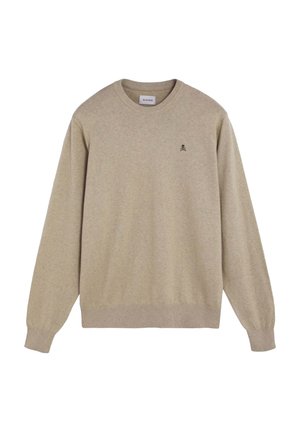 Jersey beige de manga larga y cuello redondo con puños y bajo acanalados, con un pequeño logo de calavera y huesos cruzados en el lado izquierdo del pecho.