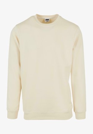 Krämfärgad sweatshirt i mjukt material, med rund halsringning och långa ärmar. Diskreta ribbade detaljer vid ärmsluten och nederkanten.