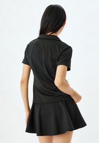 Koton Pikeepaita - black