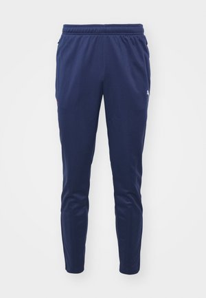 Marineblauwe sportbroek met elastische tailleband, taps toelopende pijpen, zijzakken en een klein logo-detail. Gemaakt van soepel, lichtgewicht materiaal.