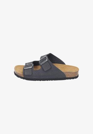 Black leather slide sandal with two adjustable metal buckles, cork footbed, and tan suede insole, shown in side profile.
