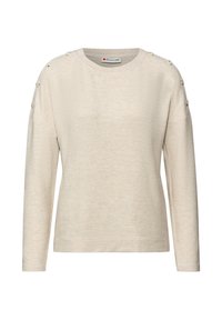 Jasnobeżowy sweter z długim rękawem wykonany z miękkiego materiału. Posiada prążkowany dekolt oraz ozdobne guziki na ramionach. Luźny fason.