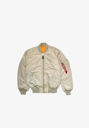 Beige bomber jacket with a front zipper, ribbed cuffs, and waistband. Features an orange lining and a red tag on the left sleeve.