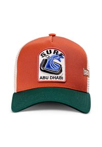 Red-orange cap with a green brim, featuring a blue embroidered wave and "SURF ABU DHABI" patch at the front. Mesh sides, structured design.
