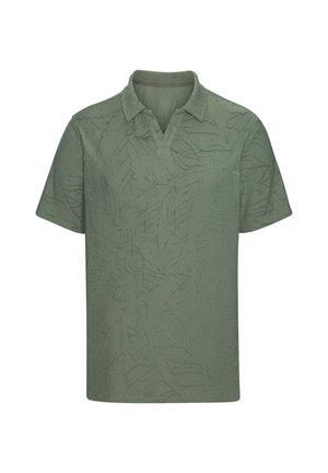 Grünes Poloshirt mit kurzen Ärmeln, dezent texturiertem Blattmuster und einem umgelegten Kragen mit kleinem V-förmigem Ausschnitt.