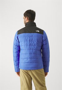 The North Face ACONCAGUA POCKET JACKET - Pūkinė striukė - solar blue/black