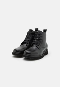 Calvin Klein Jeans EVA BOOT MID LACEUP - Botines bajos - triple black