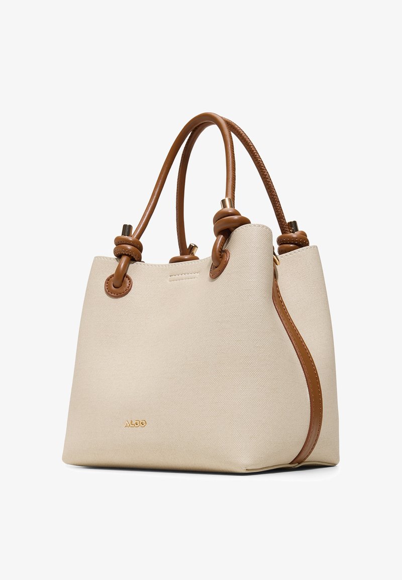 Borsa tote color crema con manici in pelle marrone caratterizzati da dettagli a nodi e finiture dorate, con piccolo logo ALDO sulla parte anteriore.