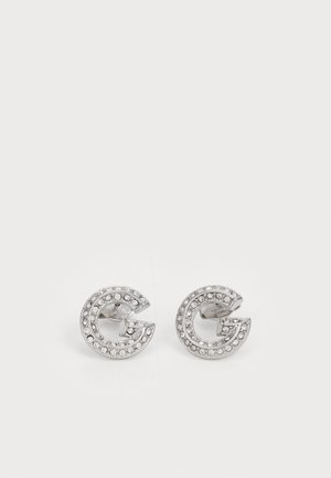 Silver stud earrings in a 'G' shape, adorned with clear rhinestones around the edges. Smooth metal finish, polished texture.