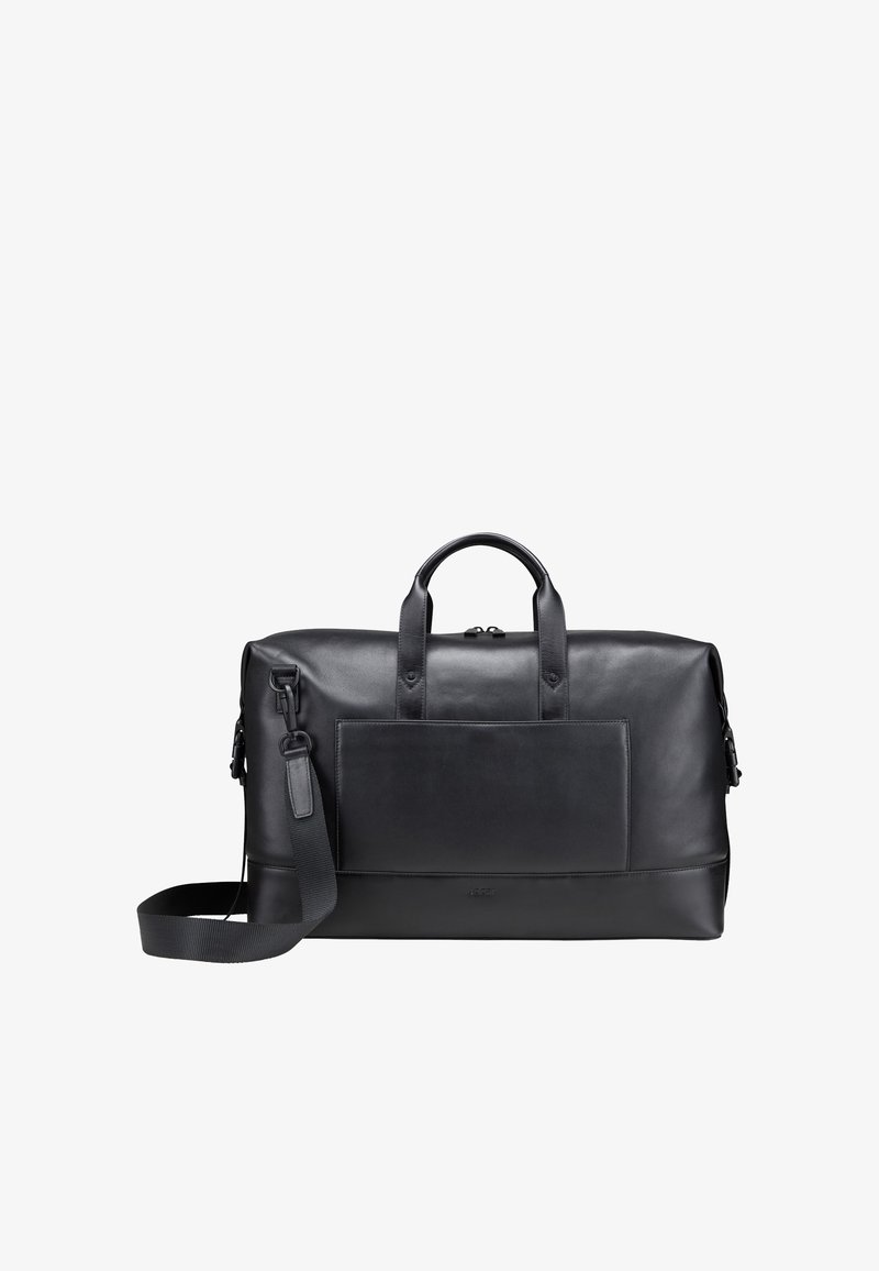Le sac de voyage en cuir noir comprend deux poignées supérieures, une bandoulière amovible et une poche avant. Texture lisse avec un design minimaliste.