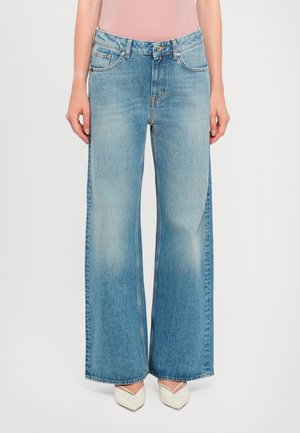 Wide-leg denim jeans in light blue, featuring a high waist, classic five-pocket design, and subtle fading along the legs.