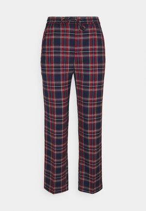 Pantalones de pijama de cuadros en azul marino y rojo con rayas blancas, cintura elástica y cierre con cordón.