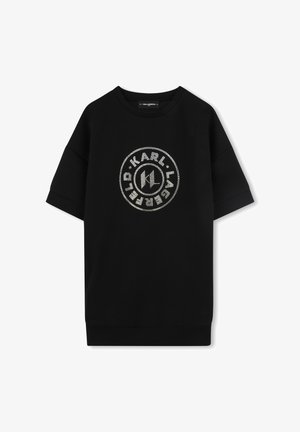 Sweat-shirt noir à manches courtes avec un grand logo circulaire en strass argentés brillants à l'avant. Fabriqué en tissu doux avec une coupe décontractée.