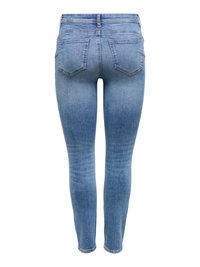 Jean skinny taille haute bleu clair avec poches arrière et décoloration sur les cuisses et les mollets, vu de dos sur fond blanc.